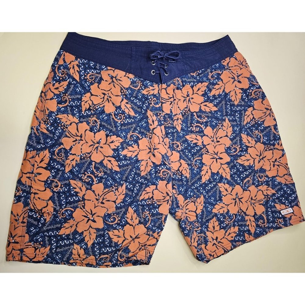 OP Board Shorts orange and blue floral design. Has a back pocket that closes sec